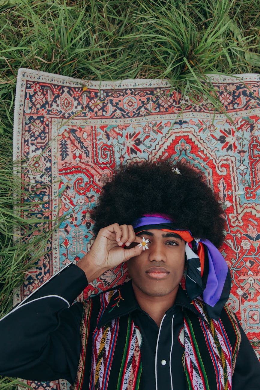 overhead shot of man with afro hair lying down